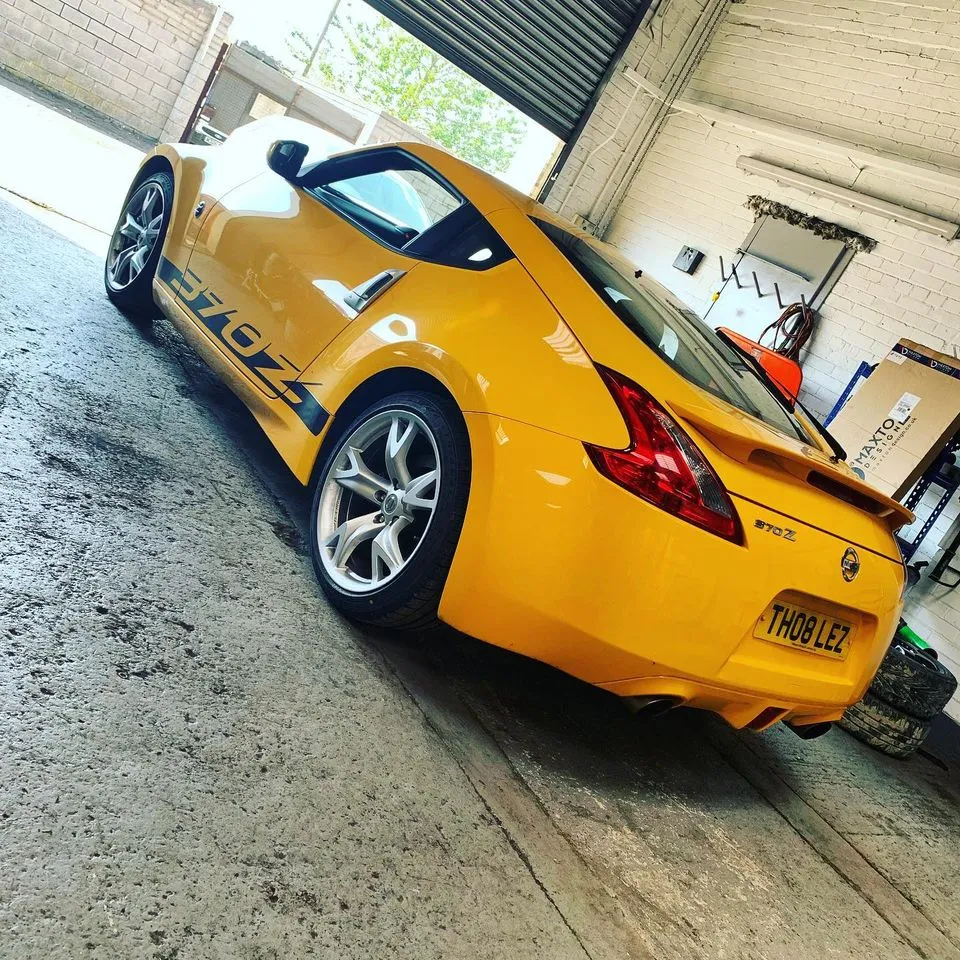 Yellow Nissan 370Z in the CJ Performance workshop, Mansfield